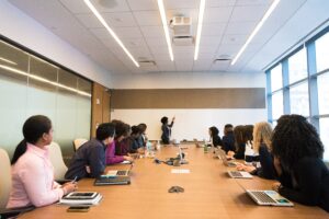 A board meeting full of people