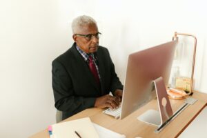 A man working at a desk on a computer