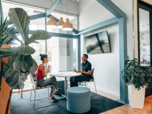people sitting in a bright room having a meeting